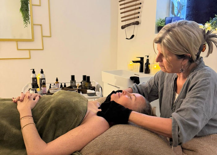 A woman is getting a facial.